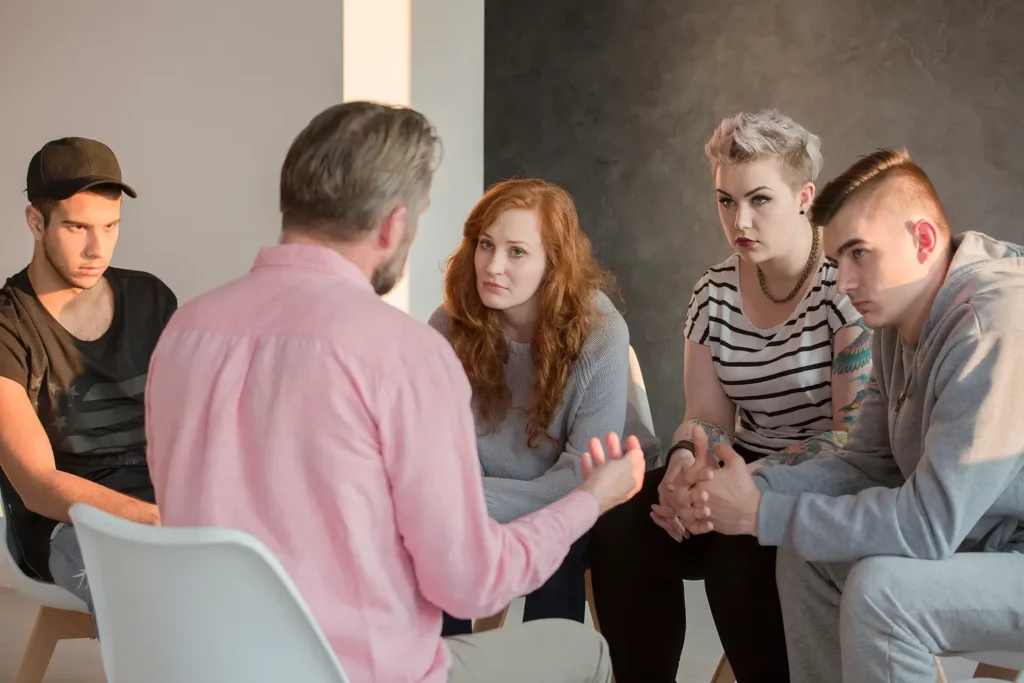 a group of people sitting in a circle