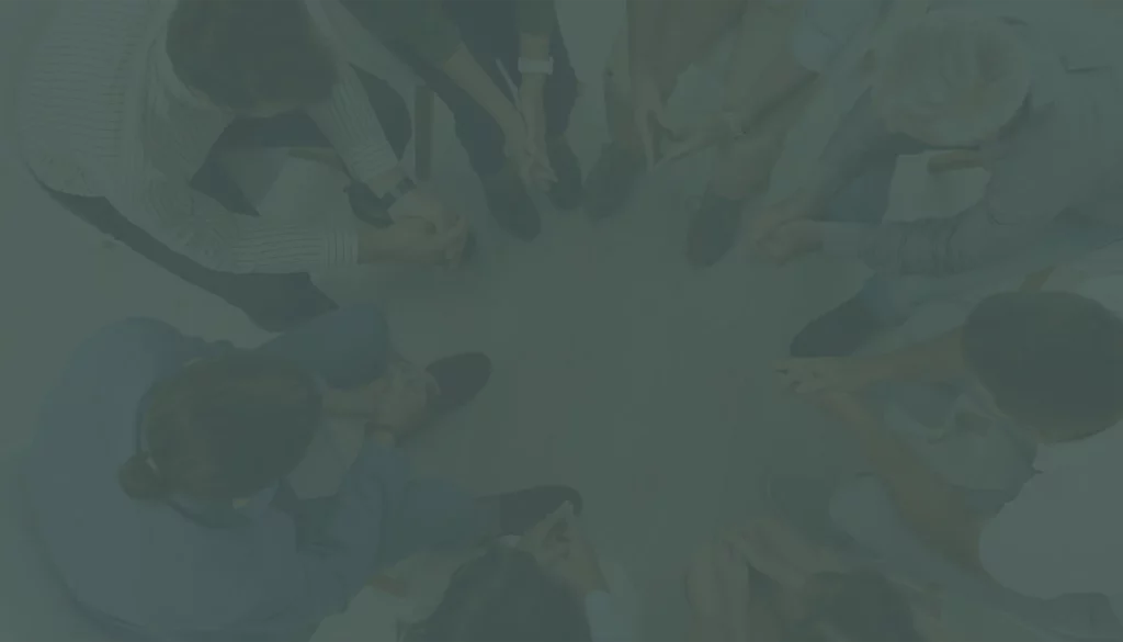 a group of people sitting in a circle