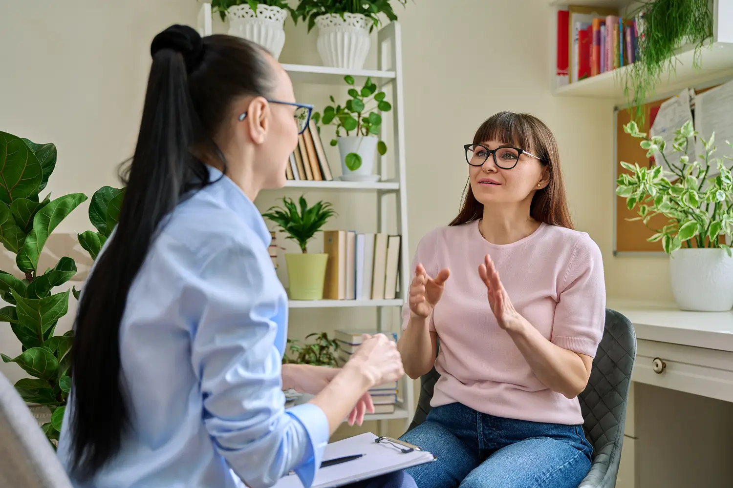 a woman talking to another woman