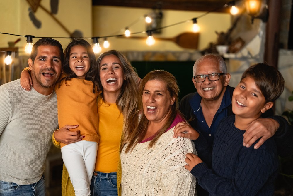 Happy Hispanic family enjoying holidays together at home